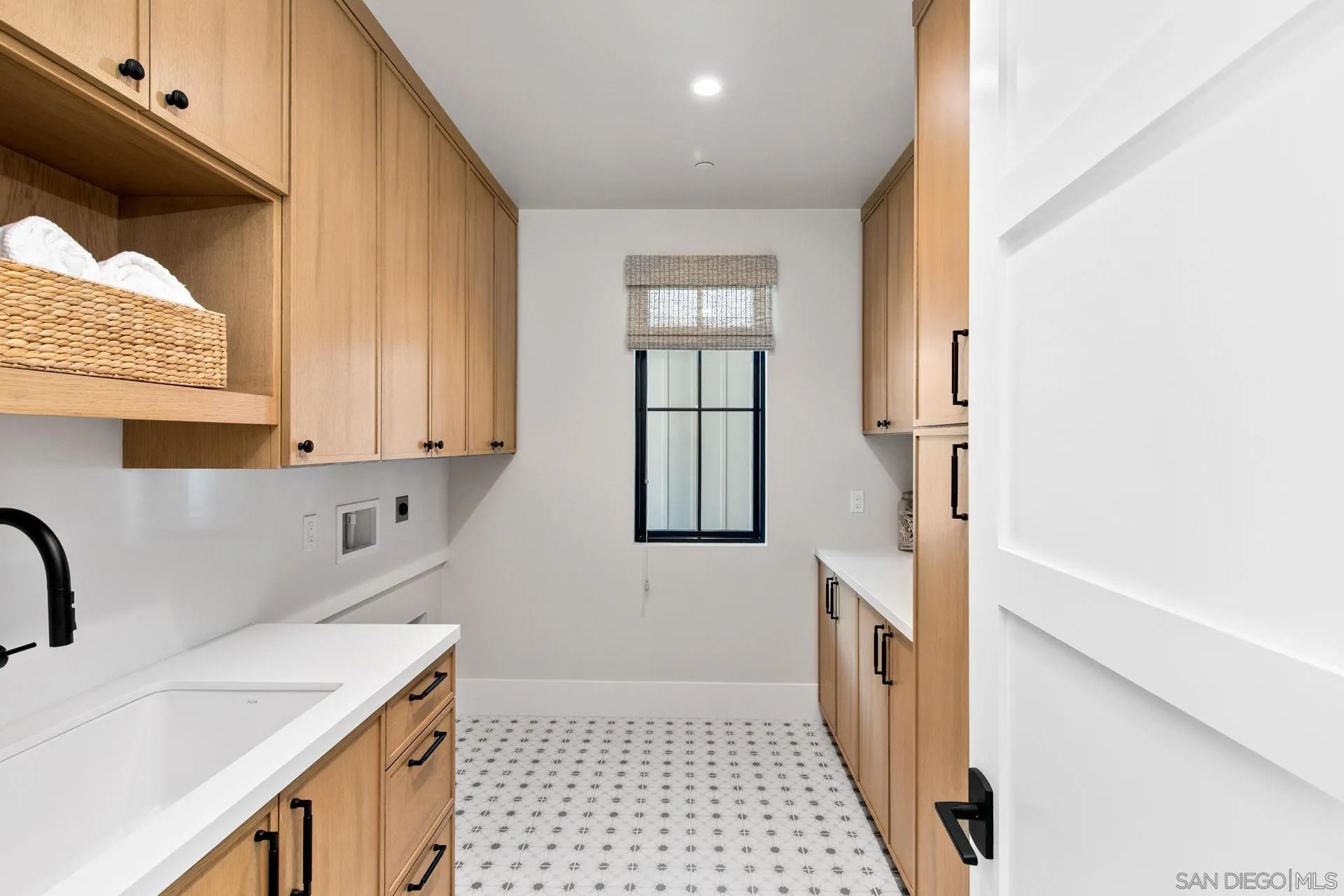 16073 Via Monte Rancho Santa Fe, CA 92067 - Photo 55 of 62 a bathroom with a sink a toilet and window