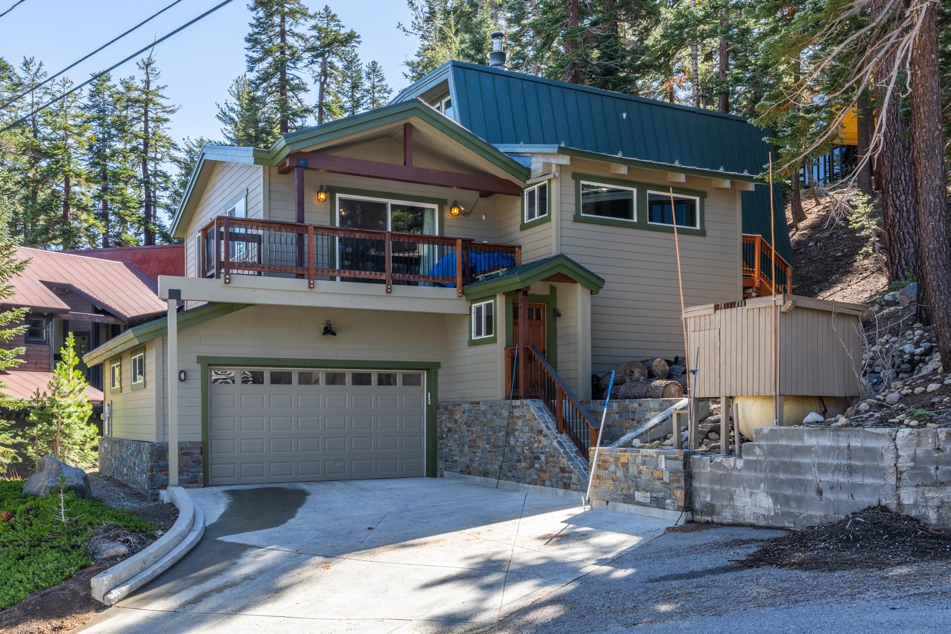 349 Davison Road Mammoth Lakes, CA 93546 - Photo 30 of 43 View of front of home featuring driveway, stone siding, stairway, and a balcony