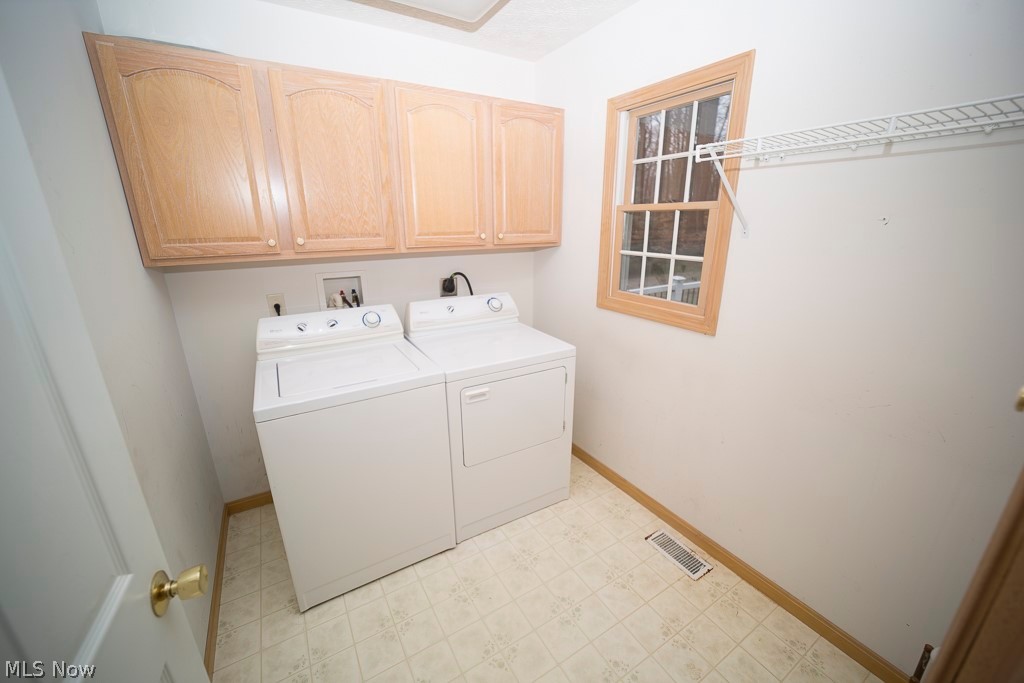 48120 Cooper Foster Park Road Amherst, OH 44001 - Photo 6 of 29 Laundry room just through the kitchen for easy laundry days!
