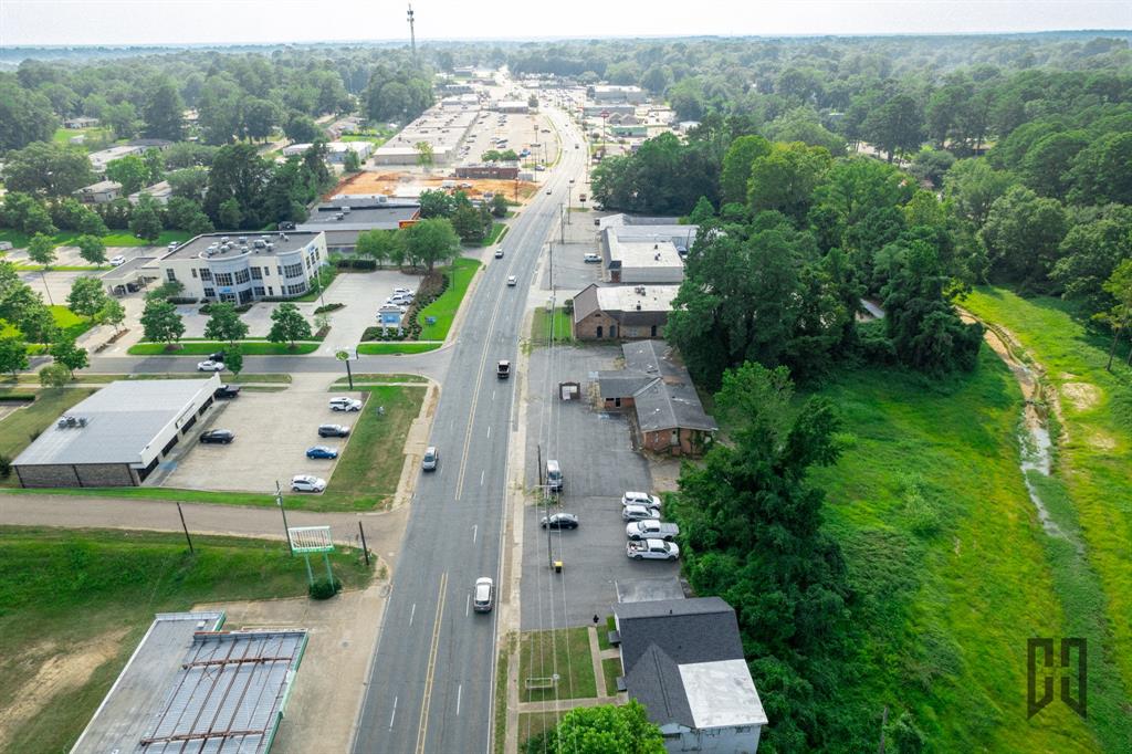 435 Homer Road Minden, LA 71055 - Photo 6 of 16 an aerial view of multiple houses with yard