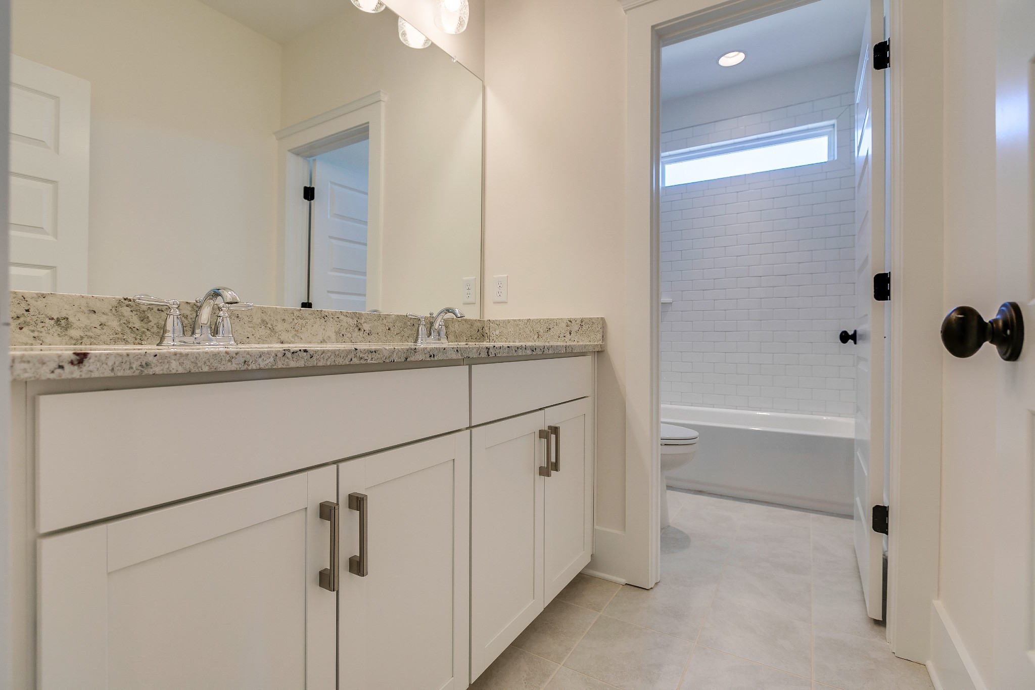 392 Dewar Drive Franklin, TN 37064 - Photo 11 of 13 a bathroom with a granite countertop sink and a mirror