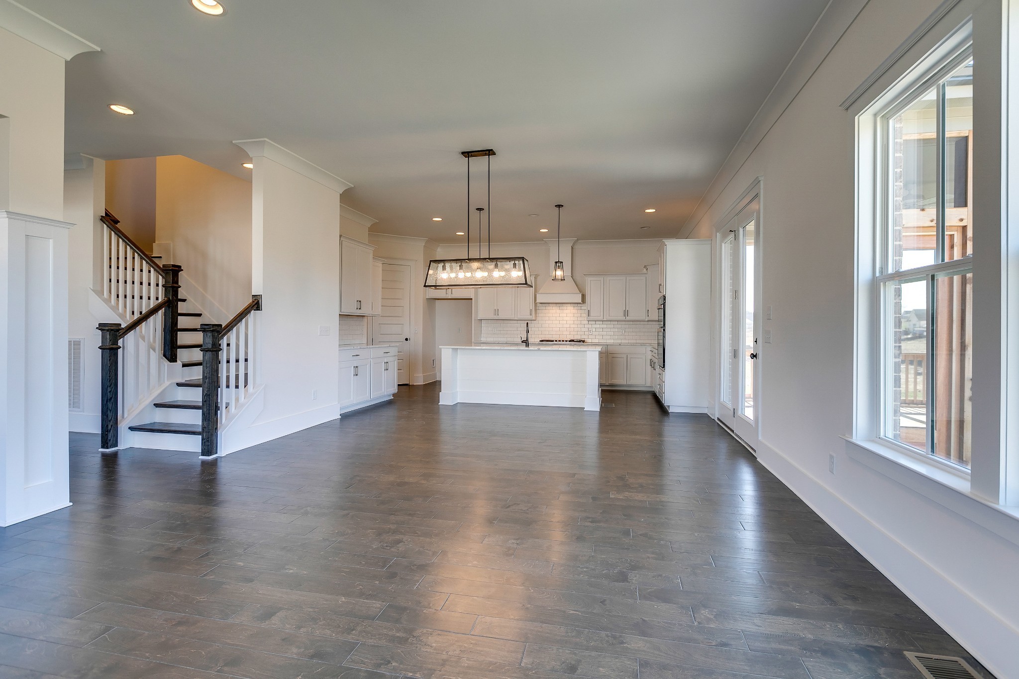 392 Dewar Drive Franklin, TN 37064 - Photo 8 of 13 a view of a kitchen with refrigerator and wooden floor