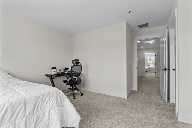 a room that has a bed and chair