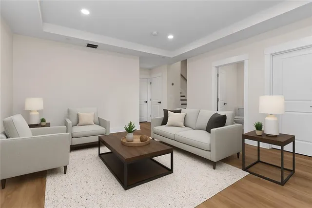 a living room with furniture and a lamp