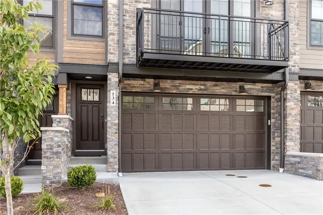 a view of house with potted plants