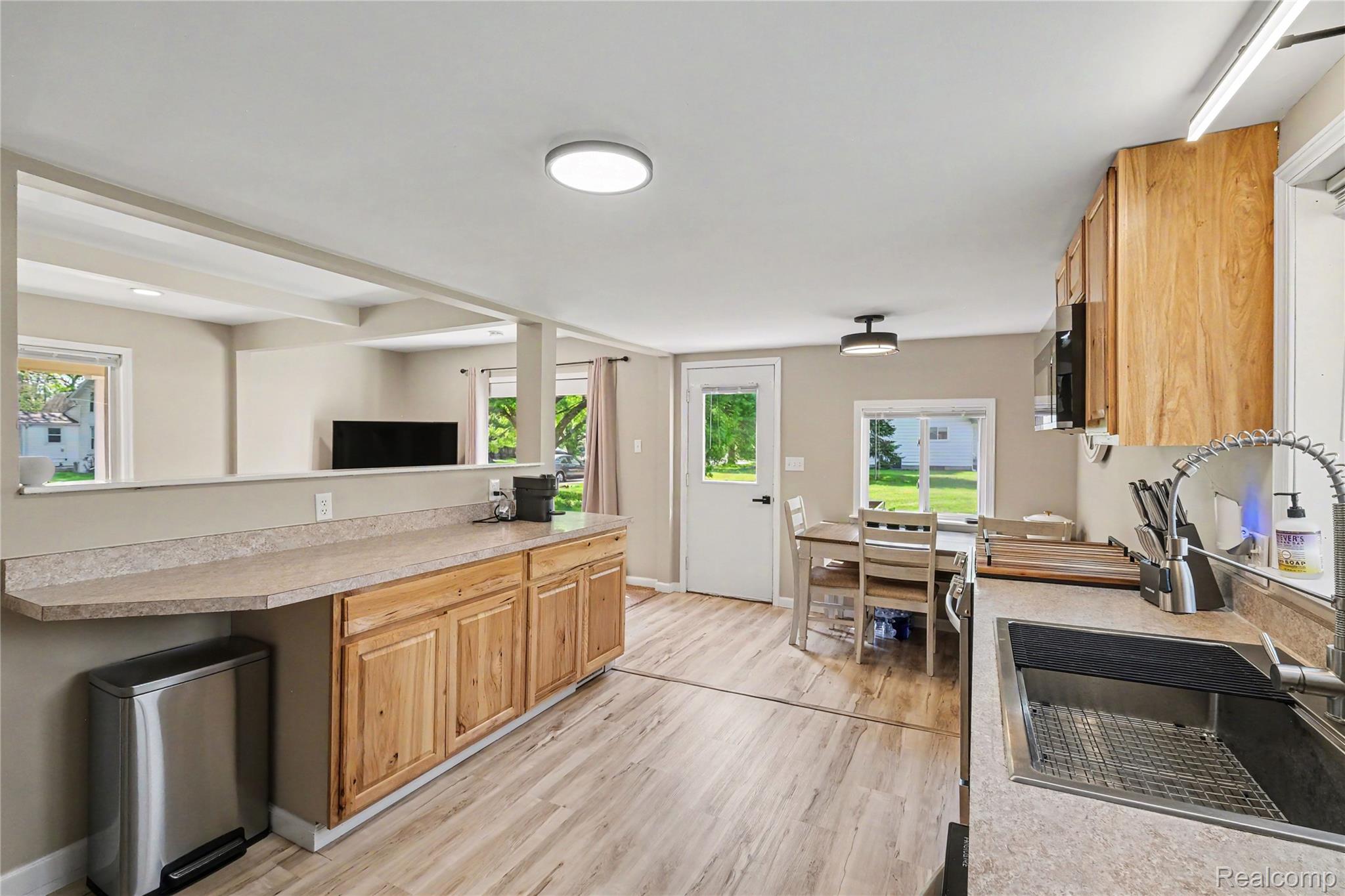 306 Mill Street Pinckney, MI 48169 - Photo 10 of 29 Newer flooring in the kitchen.