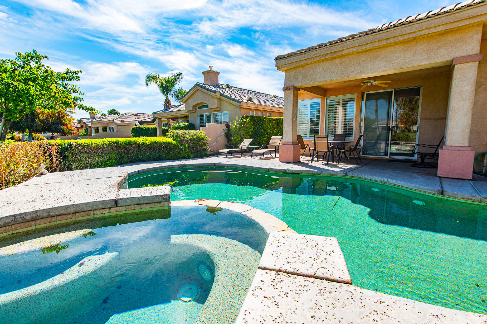 a view of a house with a yard porch and sitting area