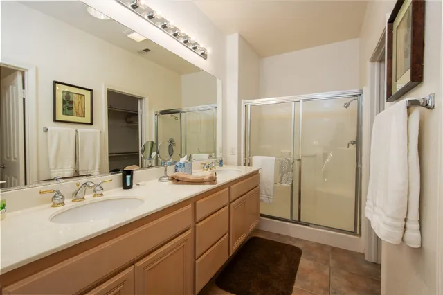 a bathroom with a double vanity sink mirror and double