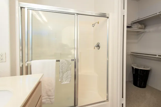 a bathroom with a shower and a tub