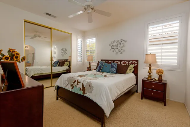 a spacious bedroom with a bed and window