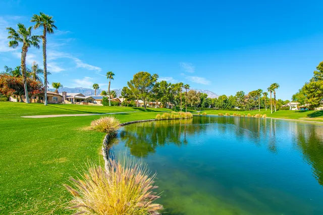 a view of a lake with a big yard
