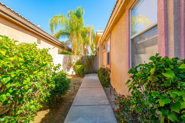 a view of a pathway with house on both side