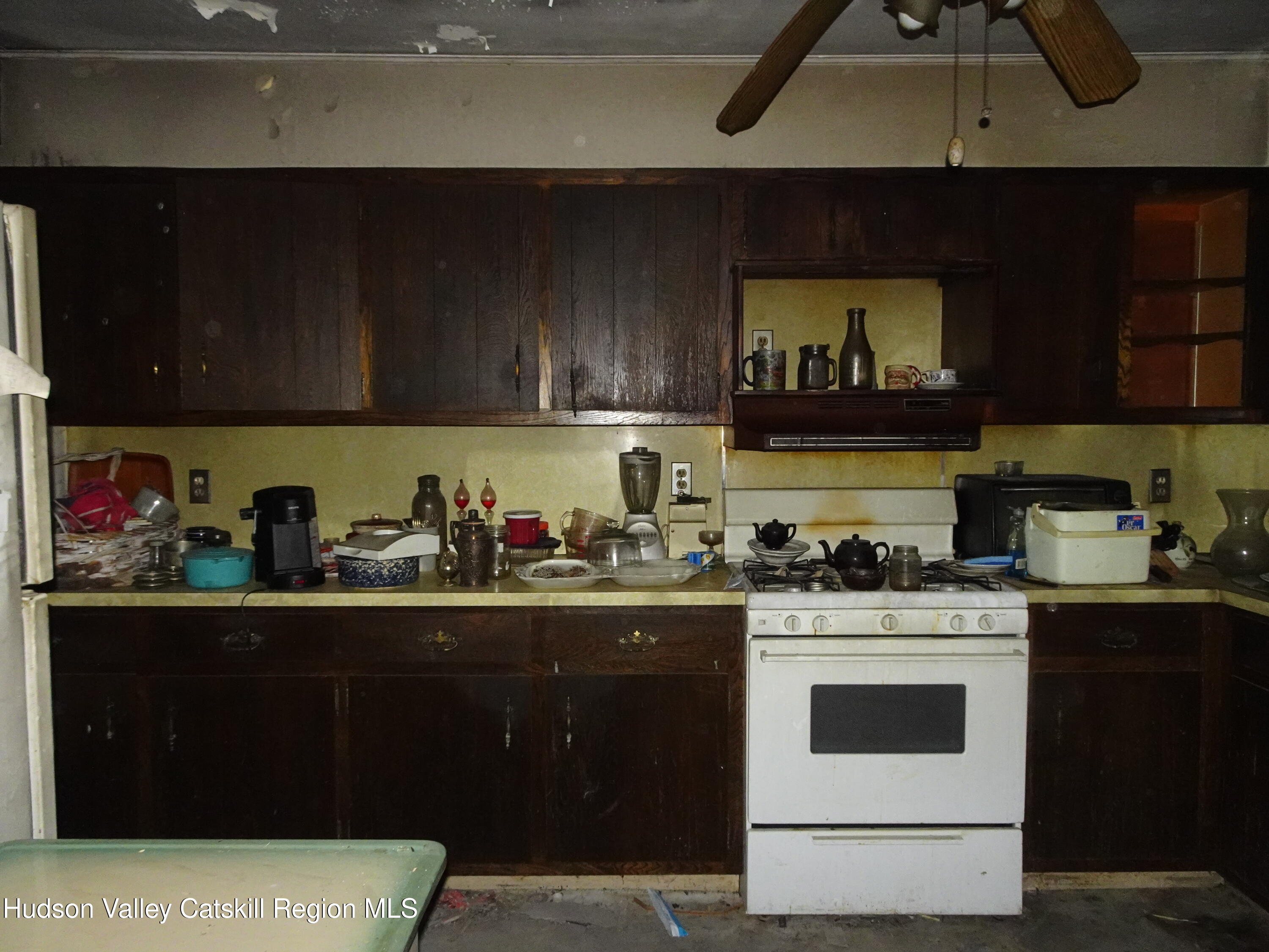 7 Old County Rte 27 Craryville, NY 12521 - Photo 14 of 39 a kitchen with a stove and cabinets