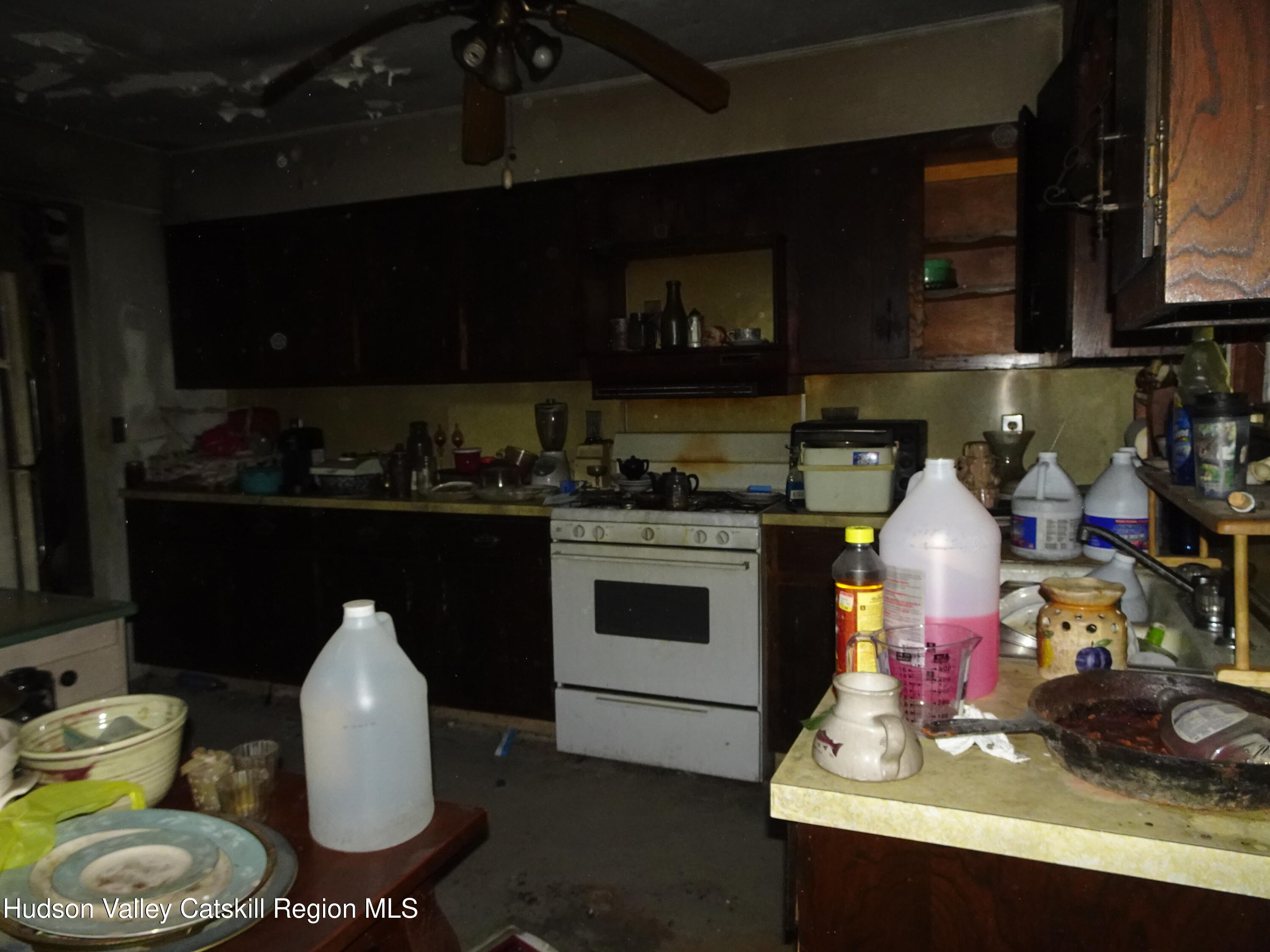 7 Old County Rte 27 Craryville, NY 12521 - Photo 16 of 39 a kitchen with a stove a sink and cabinets