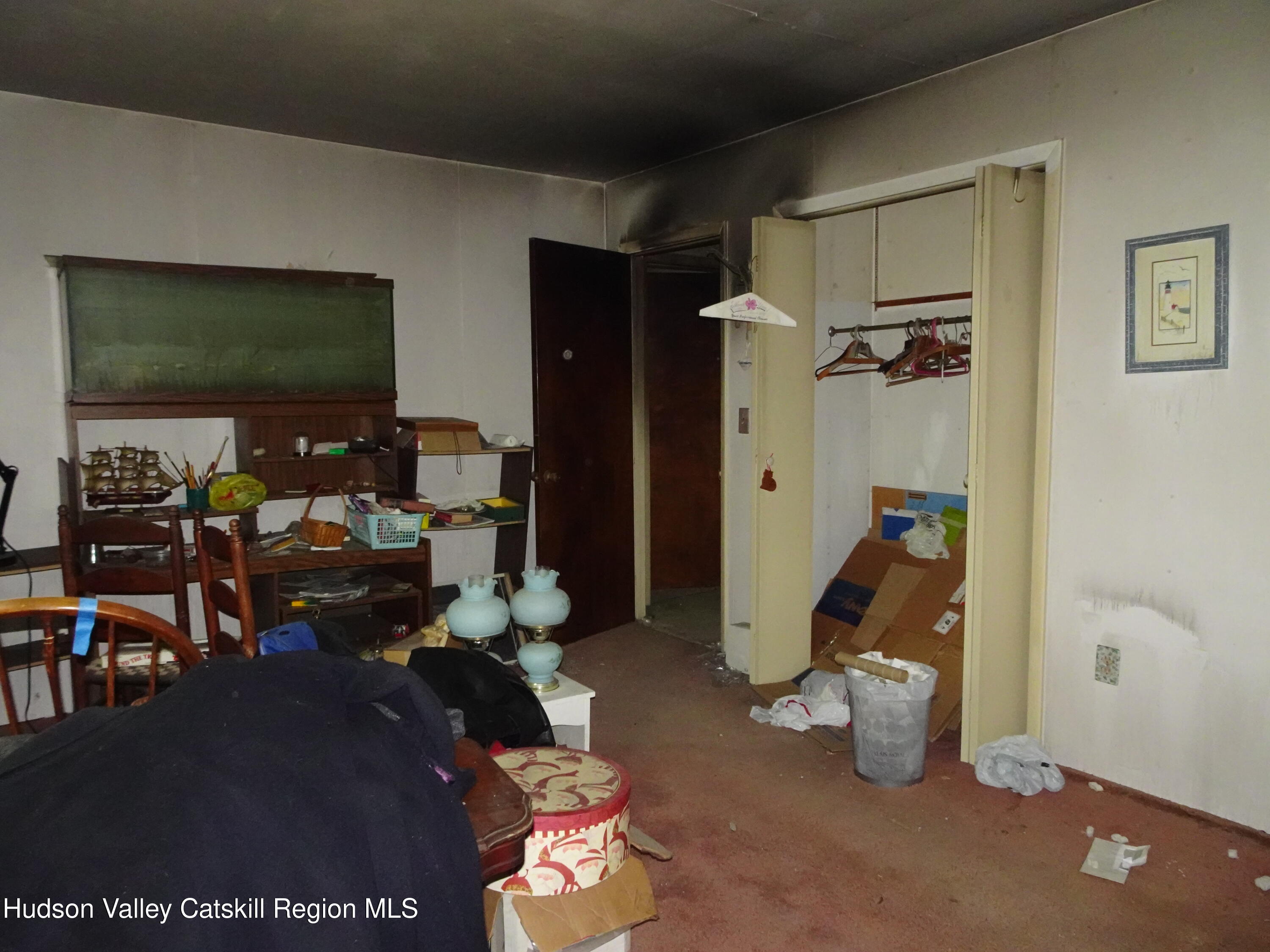 7 Old County Rte 27 Craryville, NY 12521 - Photo 23 of 39 a living room with furniture a flat screen tv and a floor to ceiling window