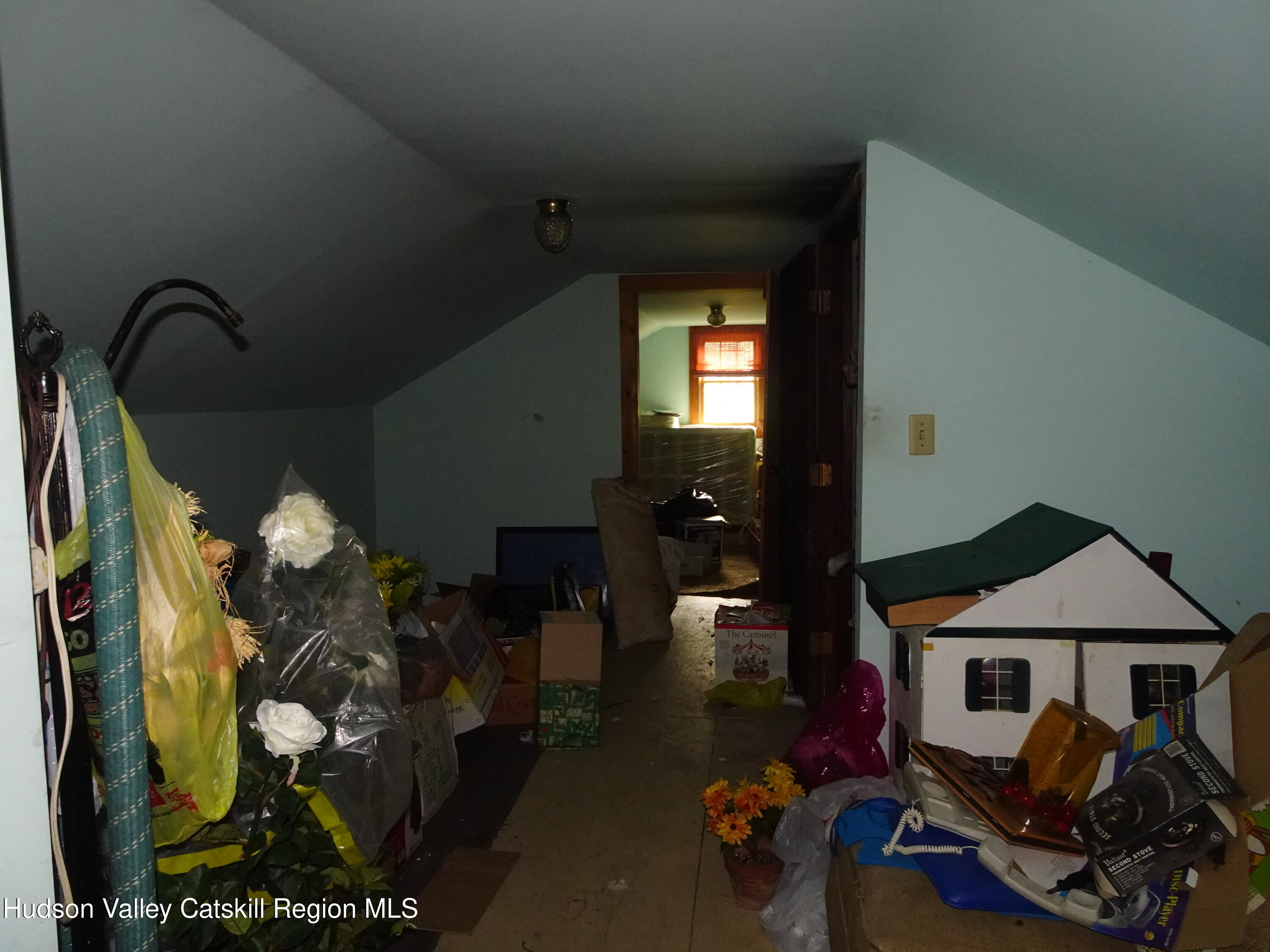 7 Old County Rte 27 Craryville, NY 12521 - Photo 27 of 39 a bedroom with a bed and a chandelier