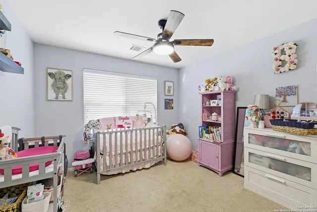 a bedroom with furniture and a window