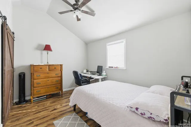 a view of balcony with chairs wooden floor and fence