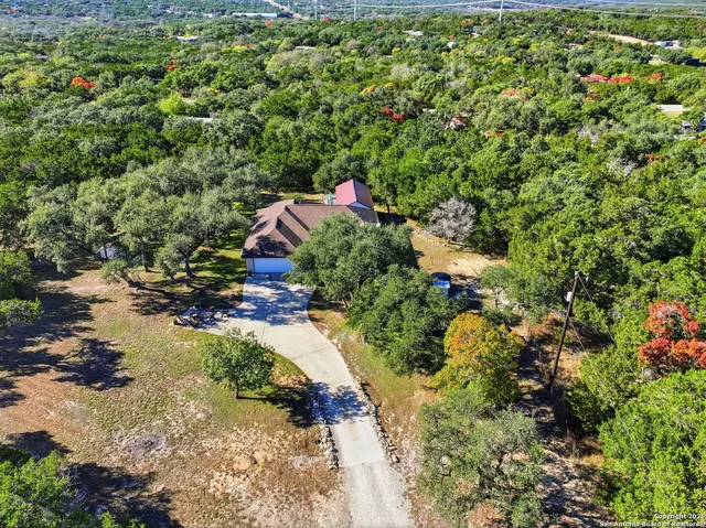 an aerial view of house with yard