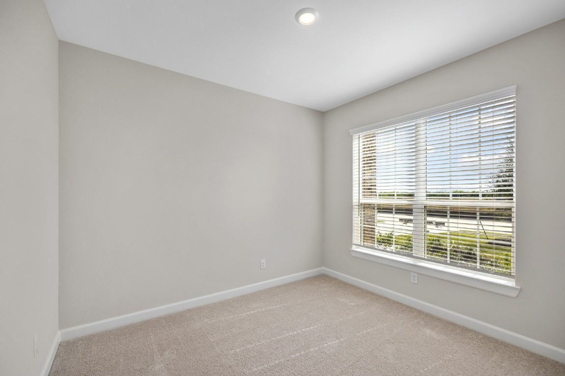 2106 Tioga Vw Drive Rosharon, TX 77583 - Photo 6 of 12 a view of an empty room with a window
