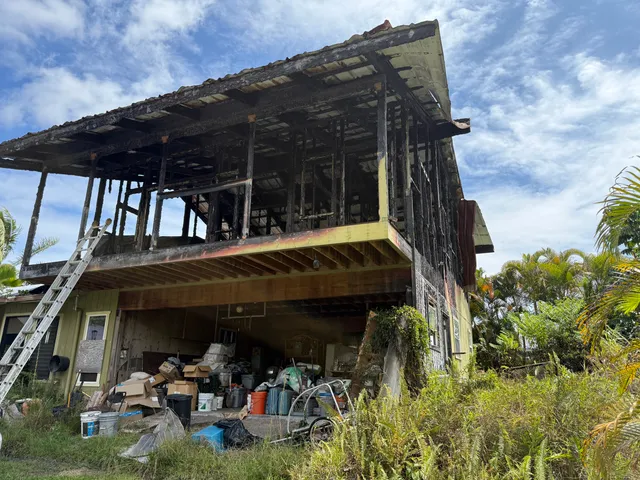 a view of a car park in front of the house