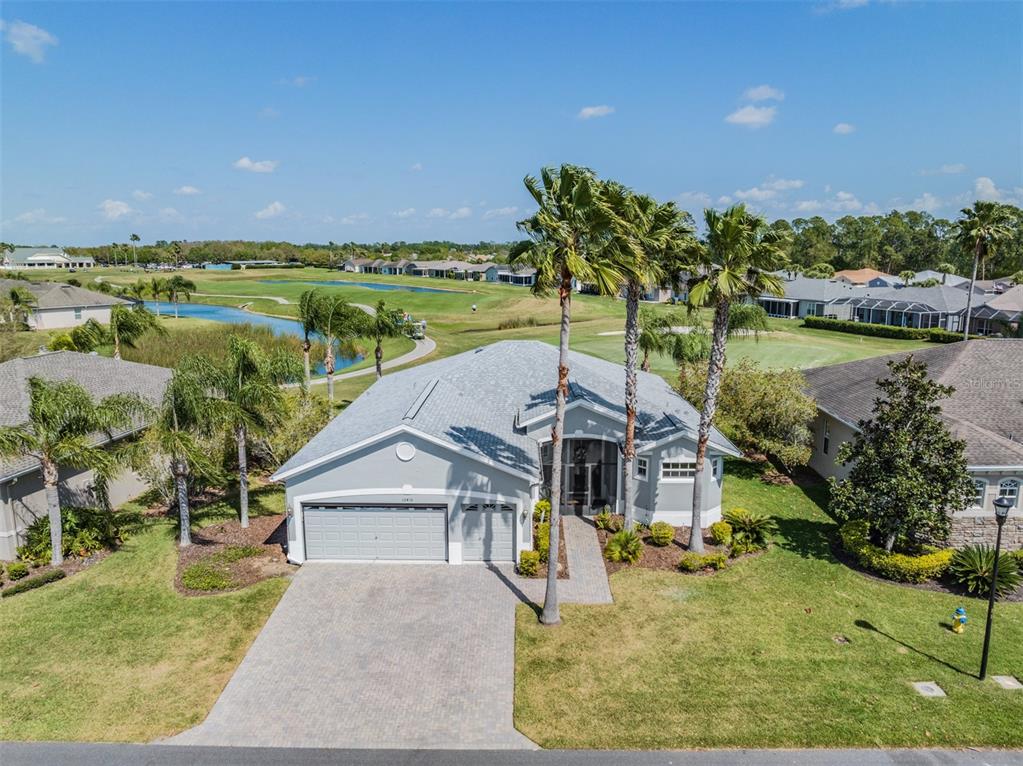 10416 Rough Road San Antonio, FL 33576 - Photo 1 of 1 Model Home with Tropical Landscape boasting Spectacular Golf Course and Water views!