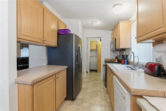 a kitchen with a stove and a microwave
