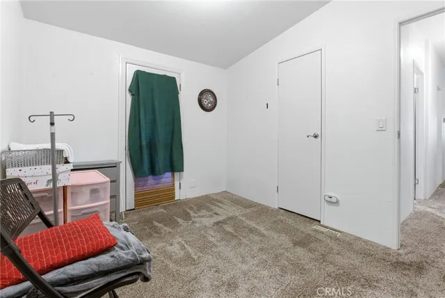 a view of a hallway with a white walls