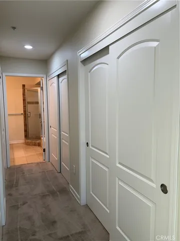 a bathroom with a granite countertop sink a toilet and a mirror