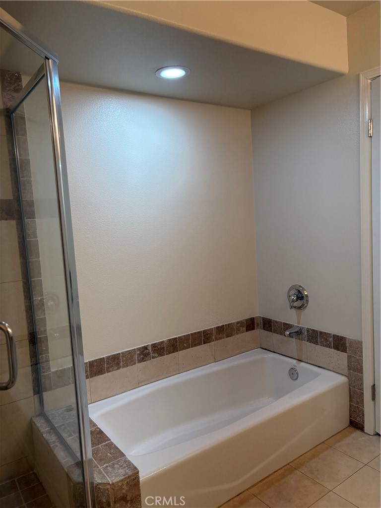 10207 Mountair Avenue, Unit 105 Tujunga, CA 91042 - Photo 25 of 32 a bathroom with a bathtub and shower