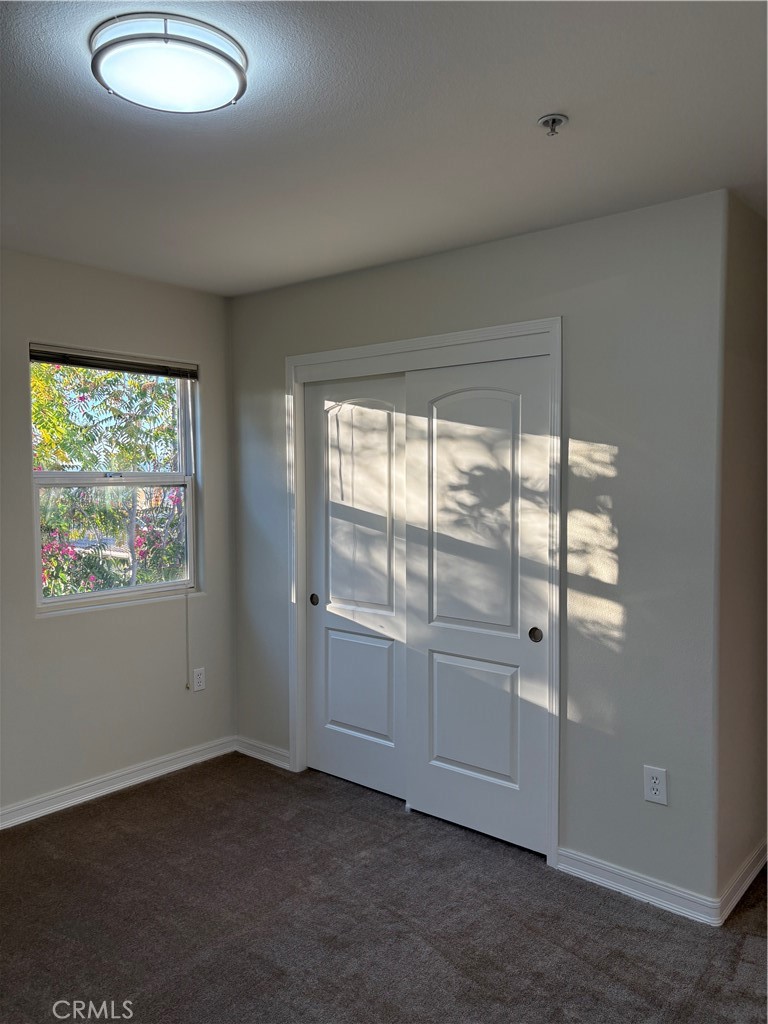 10207 Mountair Avenue, Unit 105 Tujunga, CA 91042 - Photo 27 of 32 an empty room with windows