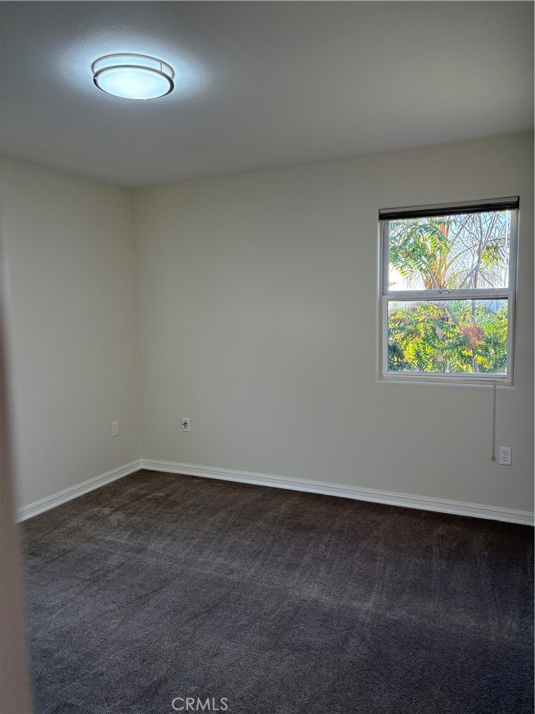 10207 Mountair Avenue, Unit 105 Tujunga, CA 91042 - Photo 30 of 32 an empty room with a window