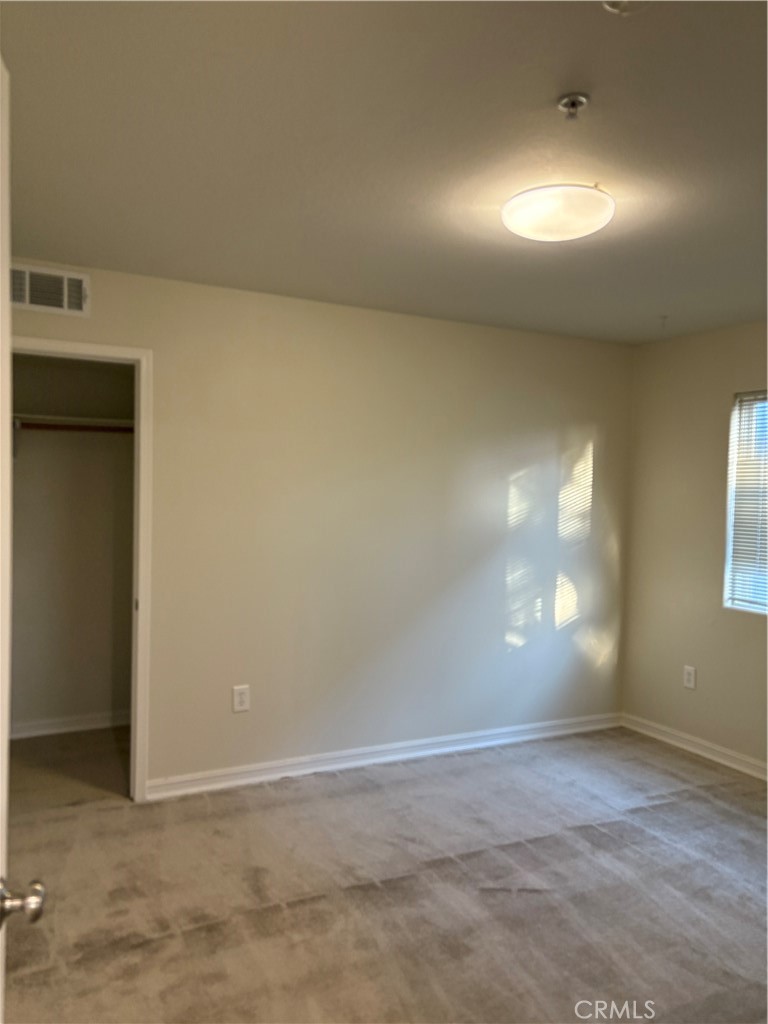 10207 Mountair Avenue, Unit 105 Tujunga, CA 91042 - Photo 32 of 32 an empty room with windows and yard