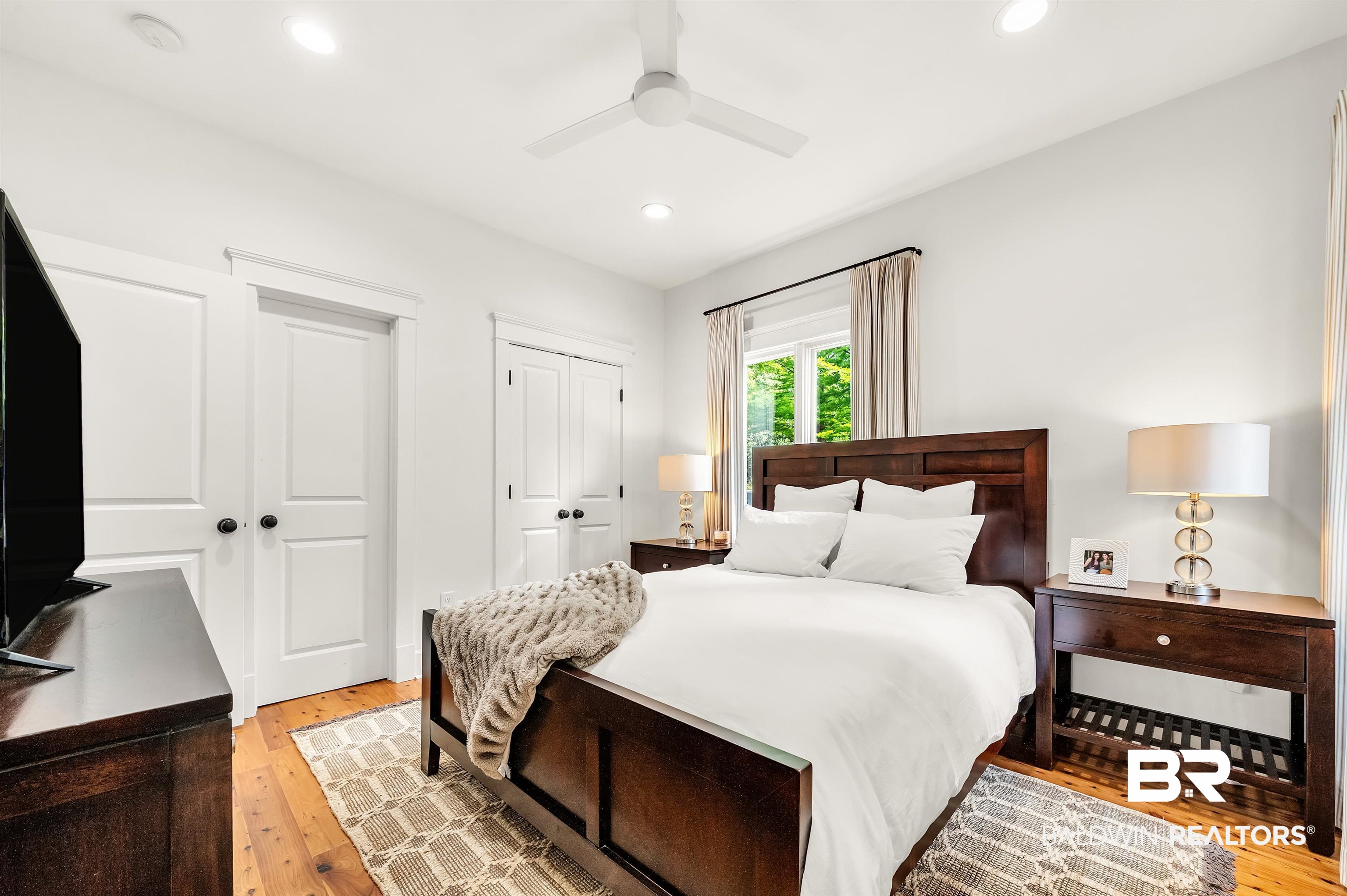32760 Steelwood Ridge Road, Unit 7 Loxley, AL 36551 - Photo 15 of 64 Bedroom featuring light wood-style flooring, two closets, recessed lighting, and a ceiling fan