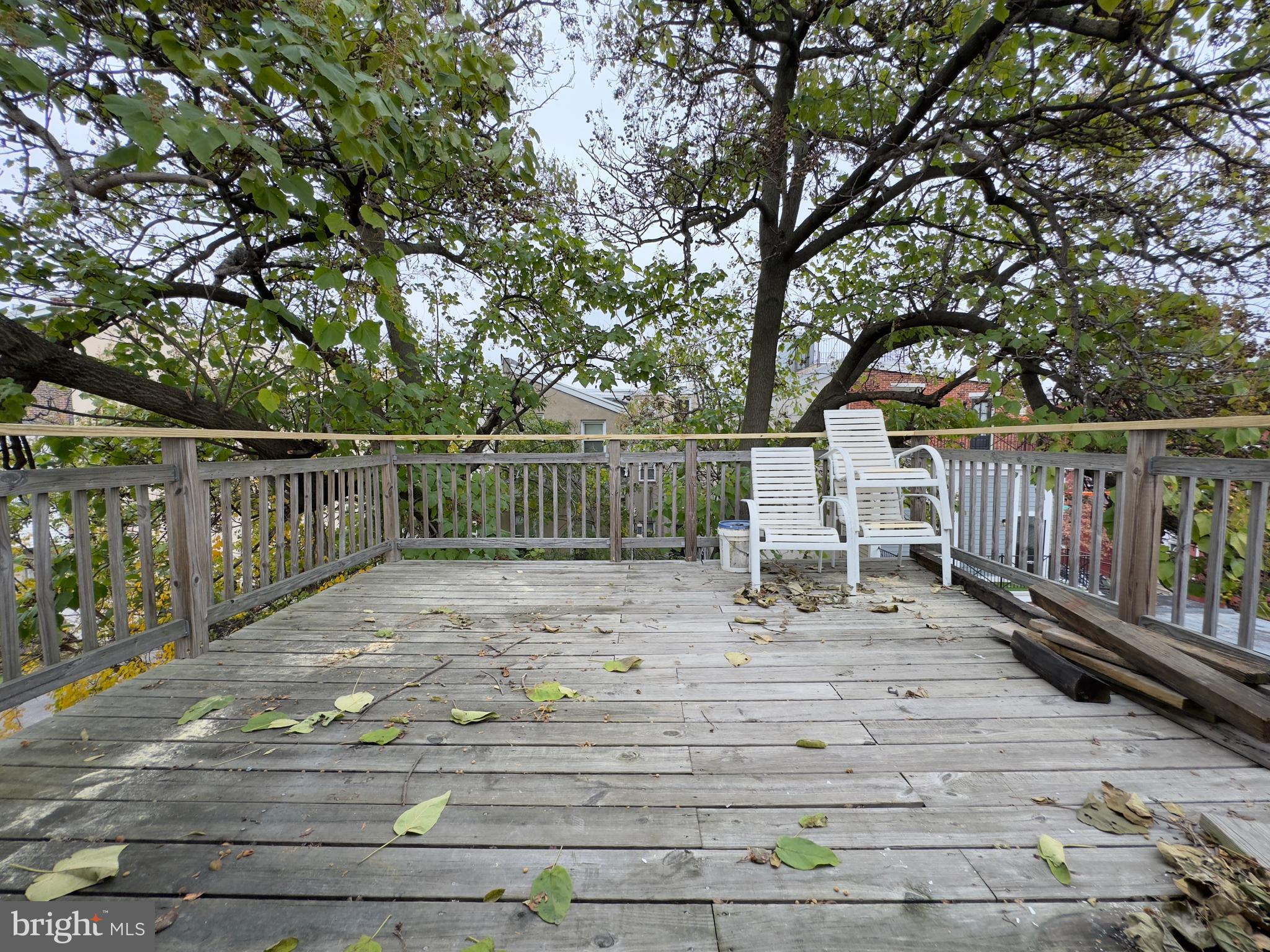 1703 Green Street, Unit 7 Philadelphia, PA 19130 - Photo 11 of 12 a view of deck with wooden floor and fence