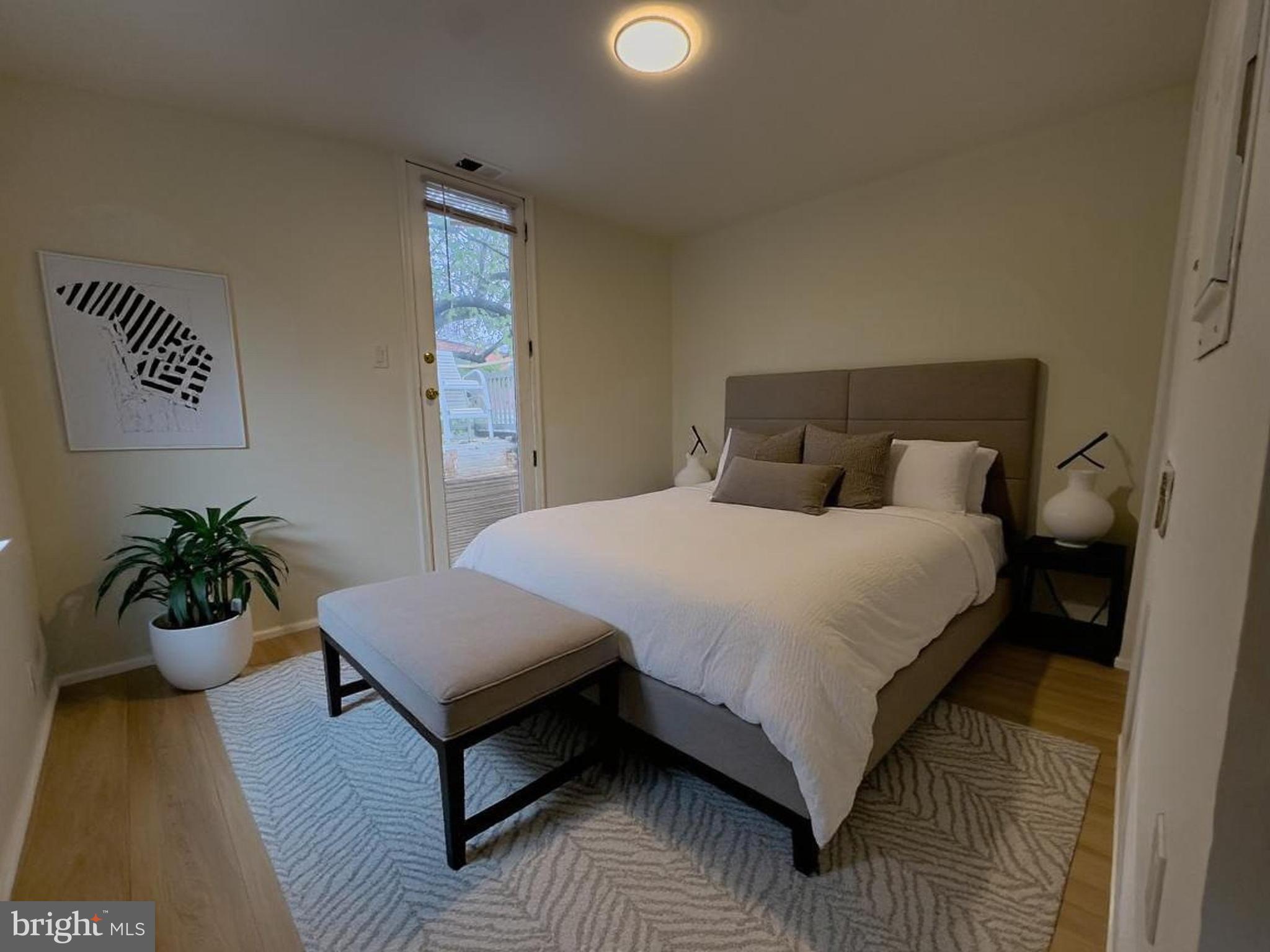 1703 Green Street, Unit 7 Philadelphia, PA 19130 - Photo 12 of 12 a bedroom with a bed and wooden floor