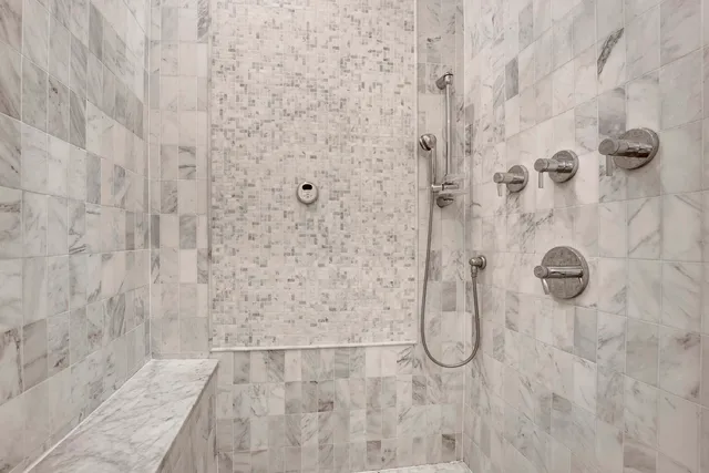 a white bath tub sitting in a bathroom