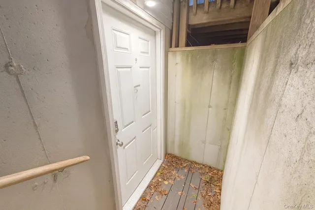 a view of a road with wooden fence