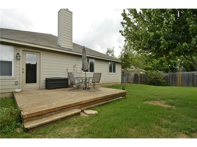 11612 Timber Heights Drive Austin, TX 78754 - Photo 22 of 28 A spacious backyard with a private wooden deck perfect for outdoor relaxation.