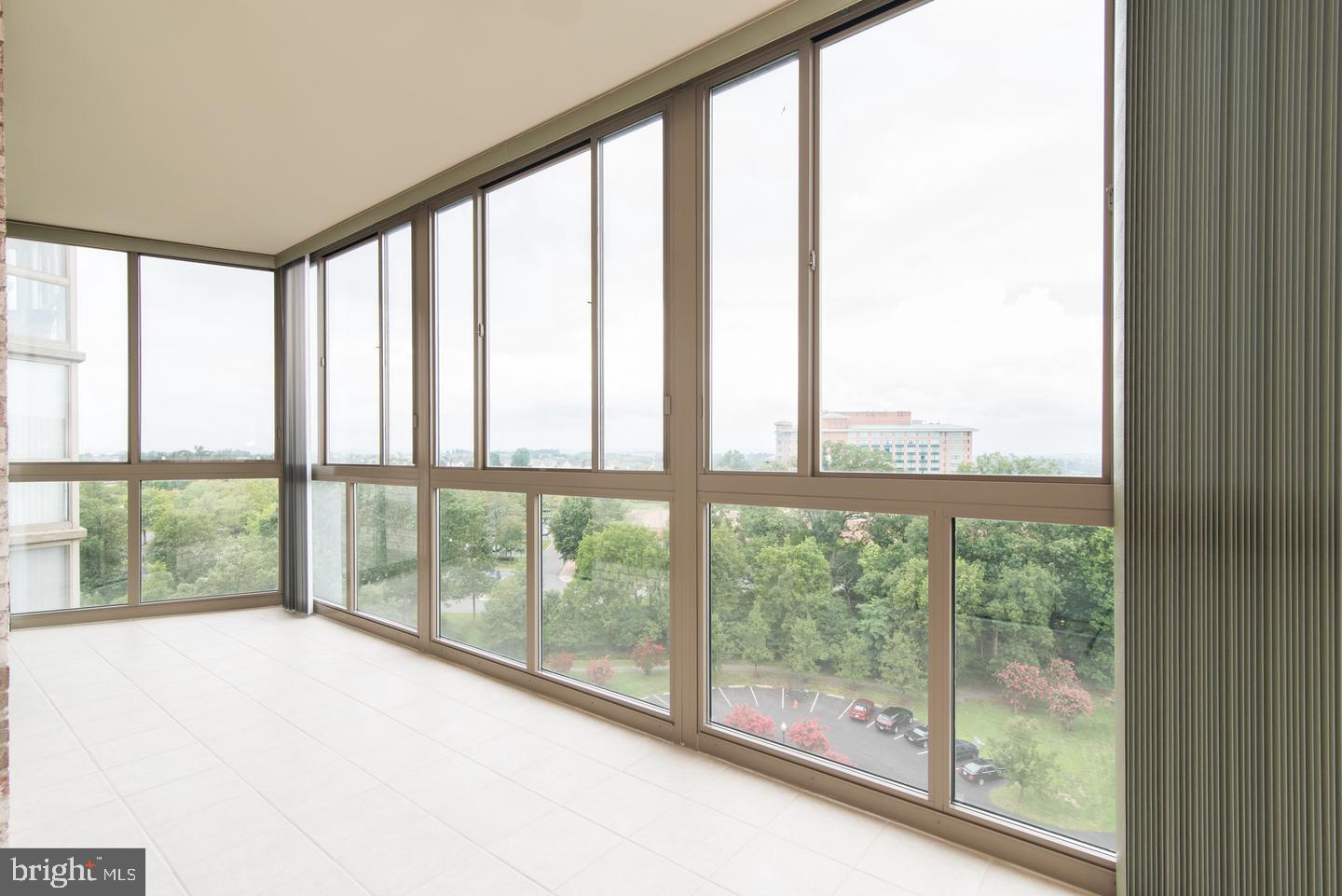 19365 Cypress Ridge Terrace, Unit 918 Leesburg, VA 20176 - Photo 2 of 8 a view of an empty room with a large window