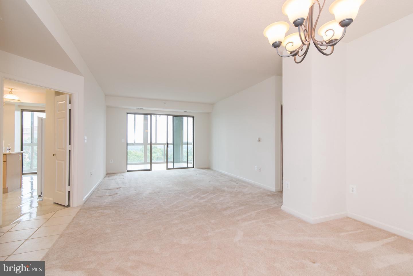 19365 Cypress Ridge Terrace, Unit 918 Leesburg, VA 20176 - Photo 5 of 8 a view of an empty room with a window