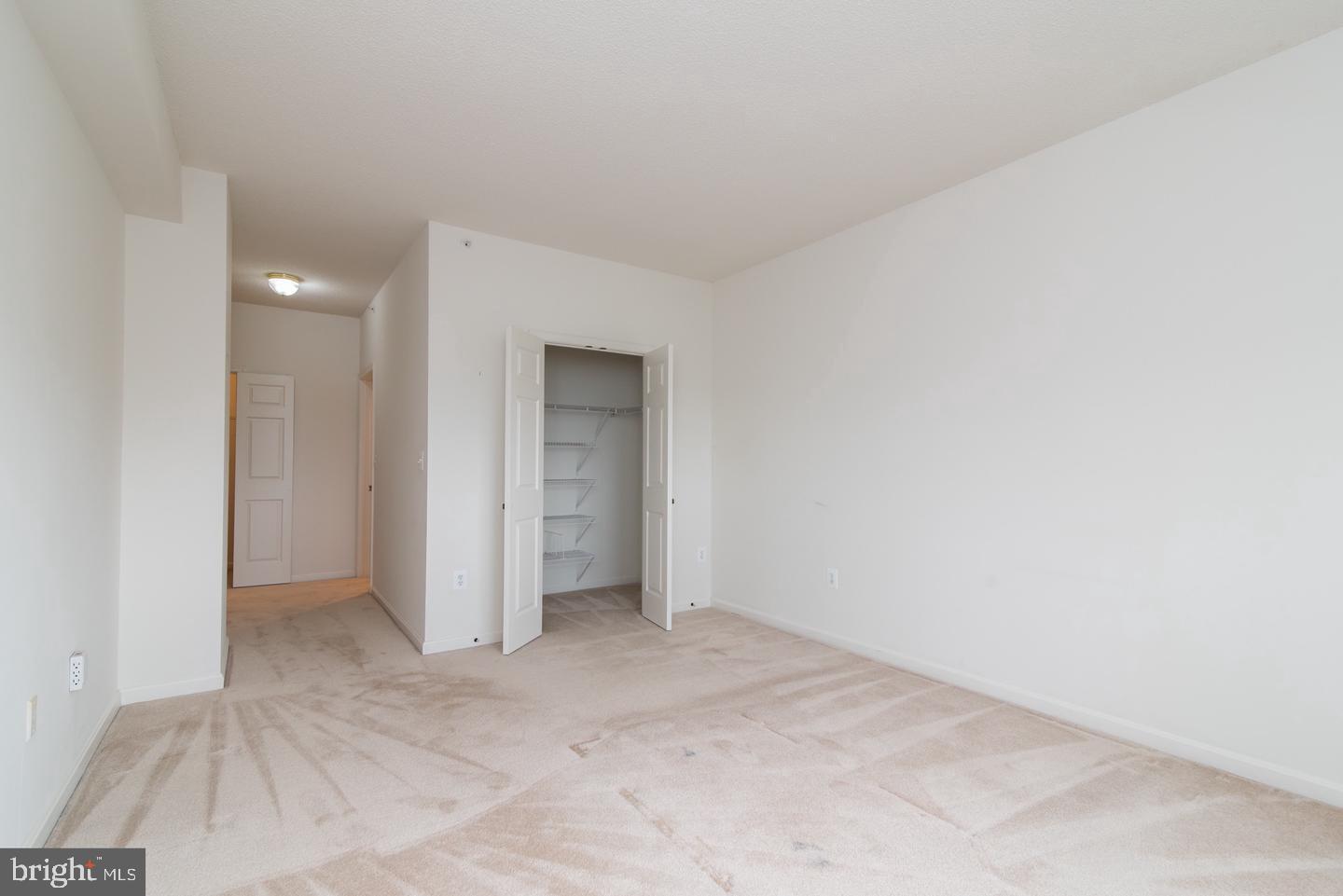19365 Cypress Ridge Terrace, Unit 918 Leesburg, VA 20176 - Photo 6 of 8 a view of an empty room and closet area