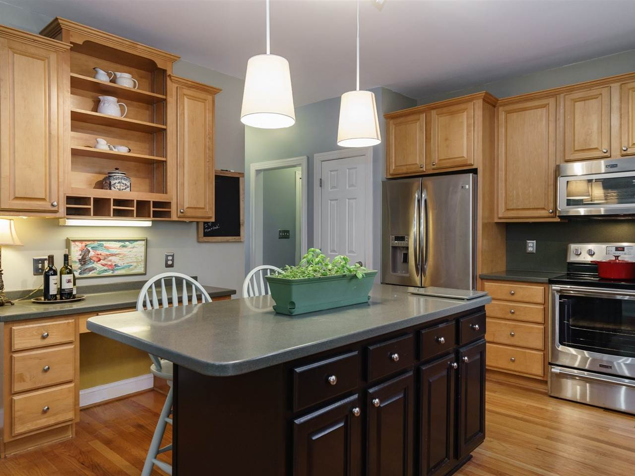 1105 Patterson Grove Road Apex, NC 27502 - Photo 5 of 25 The well-appointed kitchen will be a joy to cook in. The center island with storage is an added bonus! Kitchen