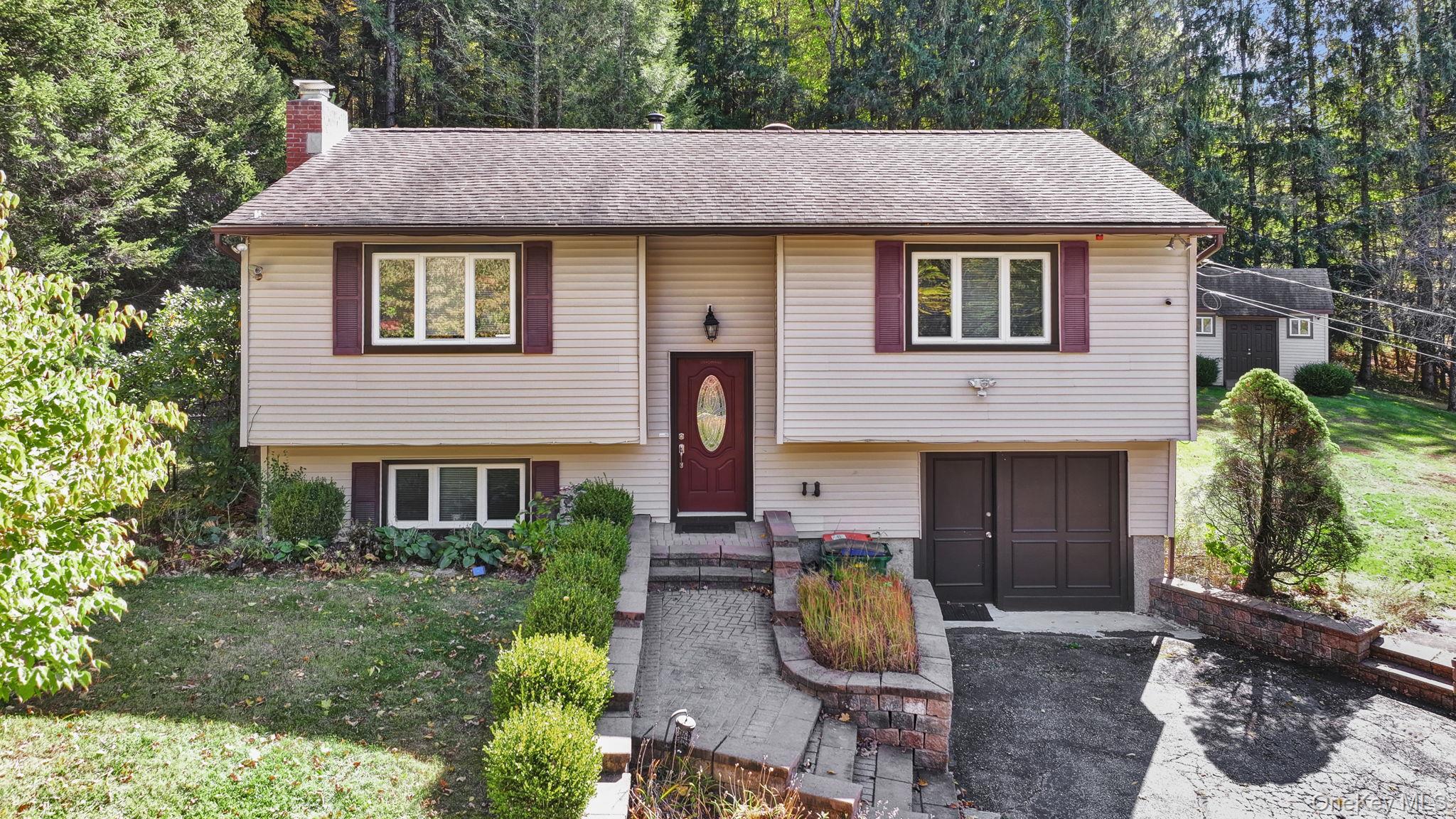 a front view of a house with garden