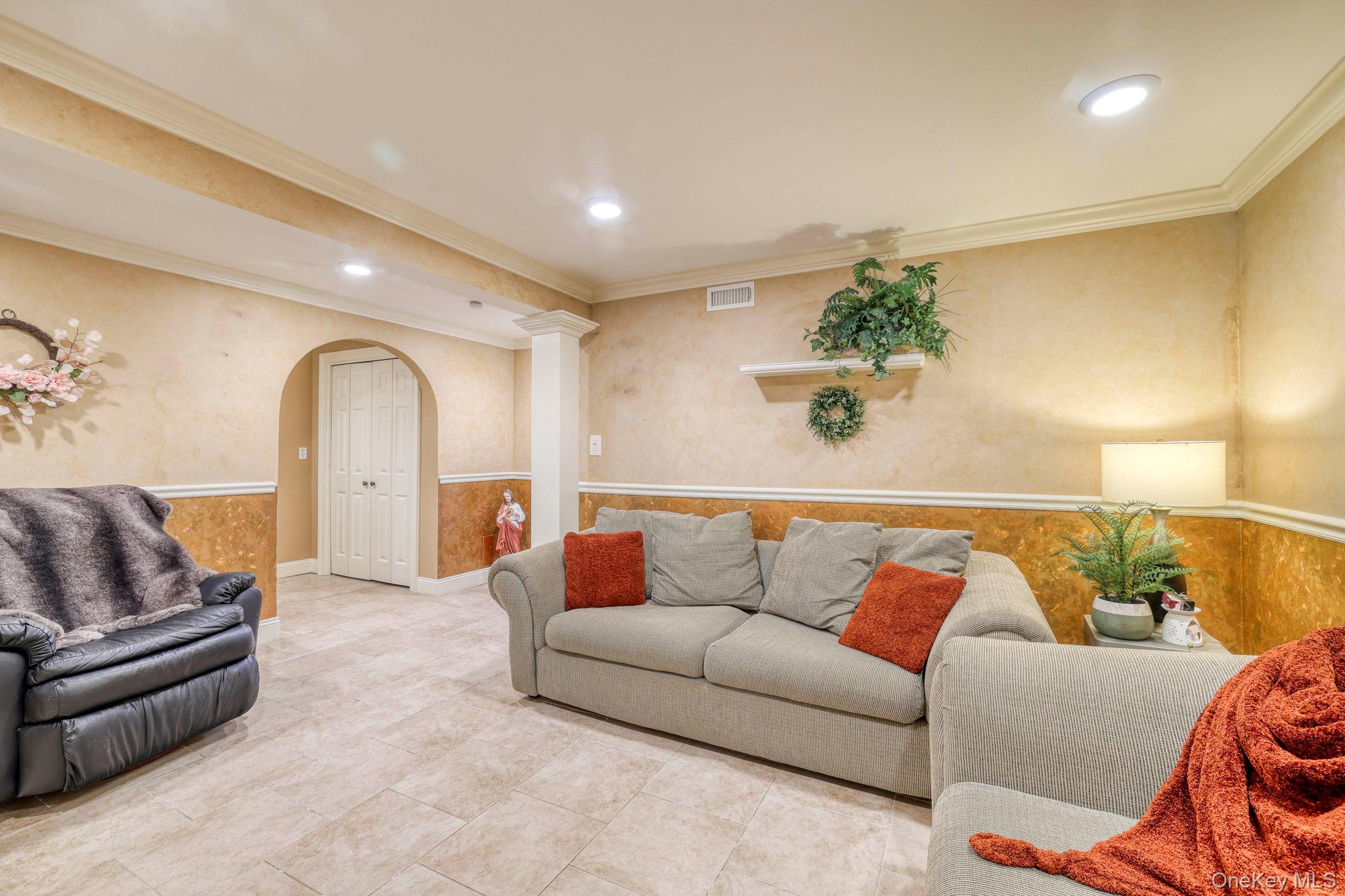 135 Barrett Hill Road Carmel, NY 10512 - Photo 20 of 37 a living room with furniture and a potted plant