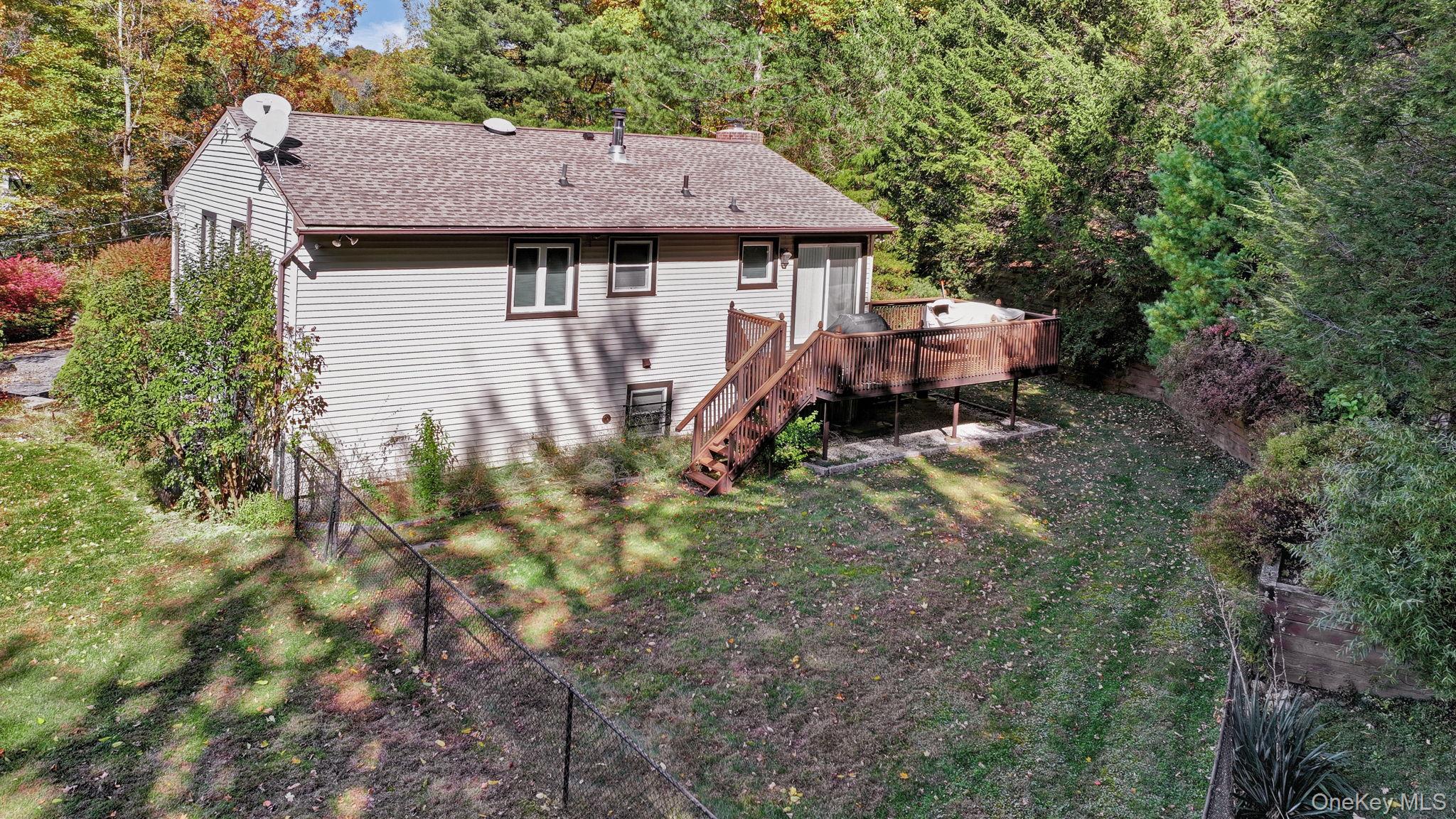 135 Barrett Hill Road Carmel, NY 10512 - Photo 28 of 37 a aerial view of a house with a yard table and chairs