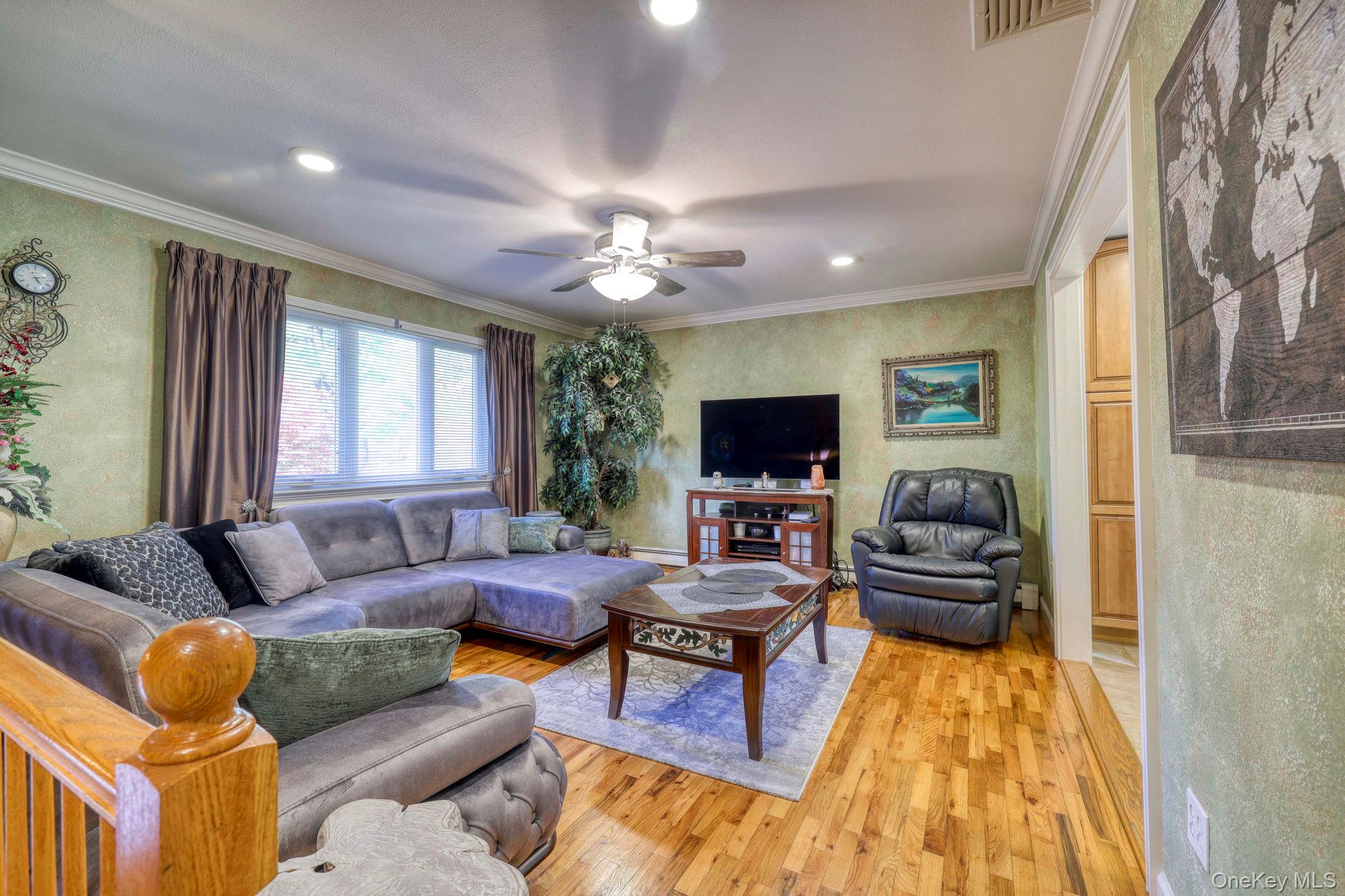 135 Barrett Hill Road Carmel, NY 10512 - Photo 3 of 37 a living room with furniture and a flat screen tv