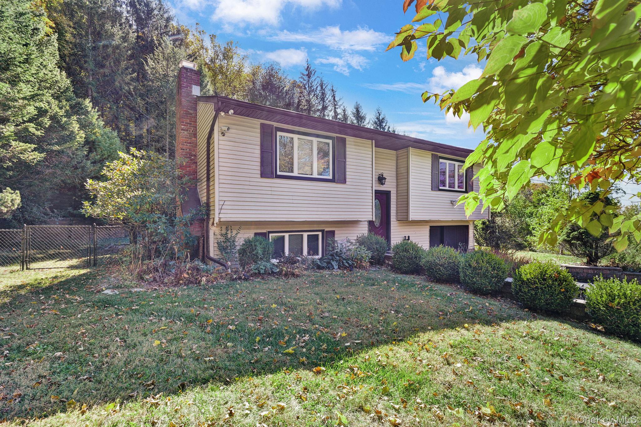 135 Barrett Hill Road Carmel, NY 10512 - Photo 33 of 37 a front view of a house with garden