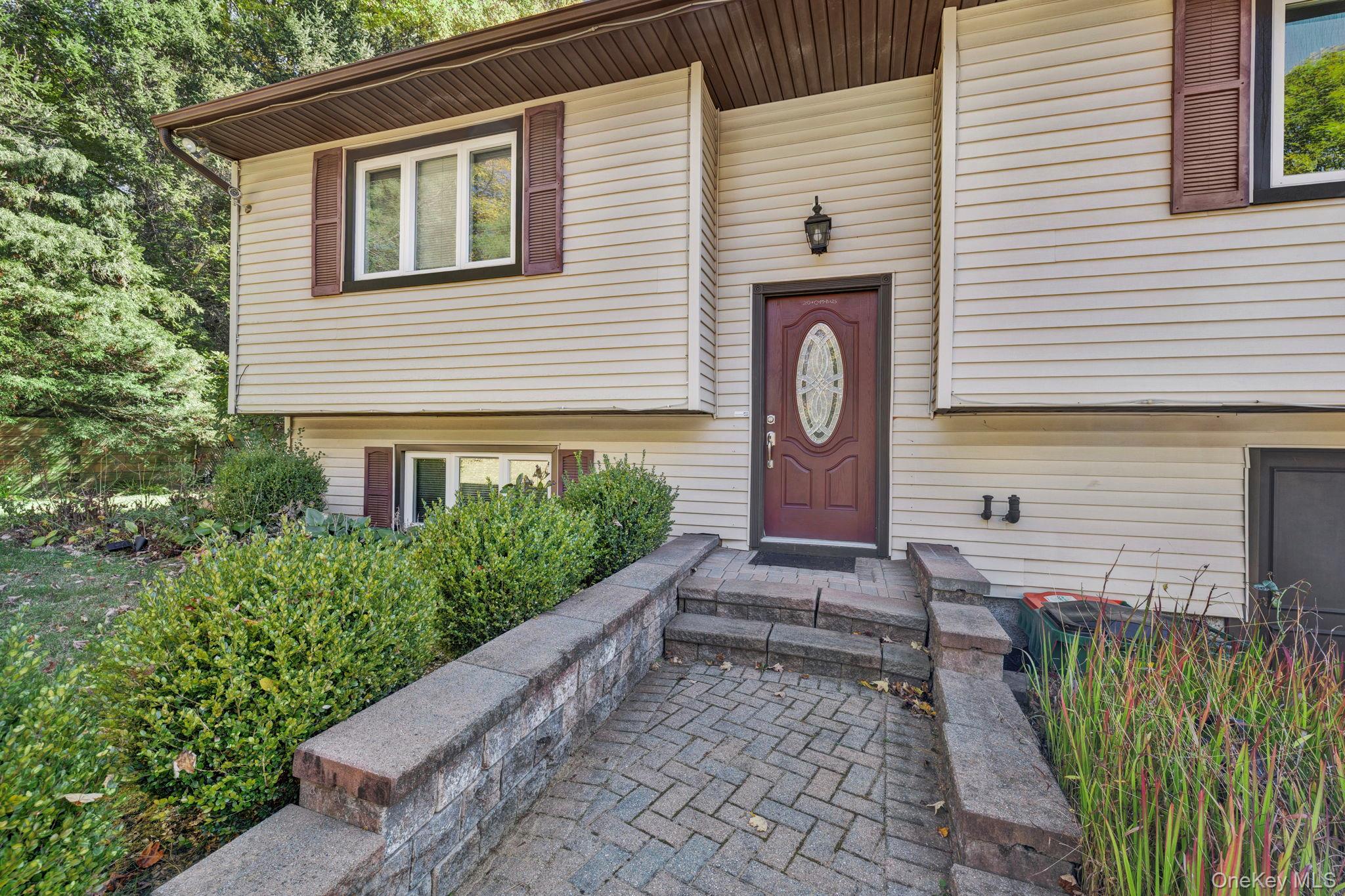 135 Barrett Hill Road Carmel, NY 10512 - Photo 37 of 37 a front view of a house with a yard