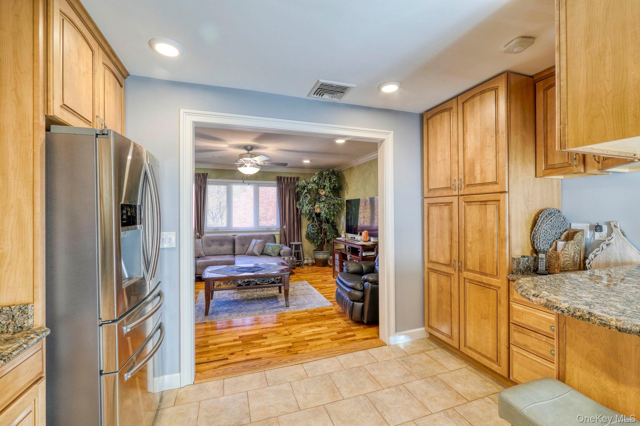 135 Barrett Hill Road Carmel, NY 10512 - Photo 7 of 37 a kitchen with stainless steel appliances granite countertop a refrigerator and a sink
